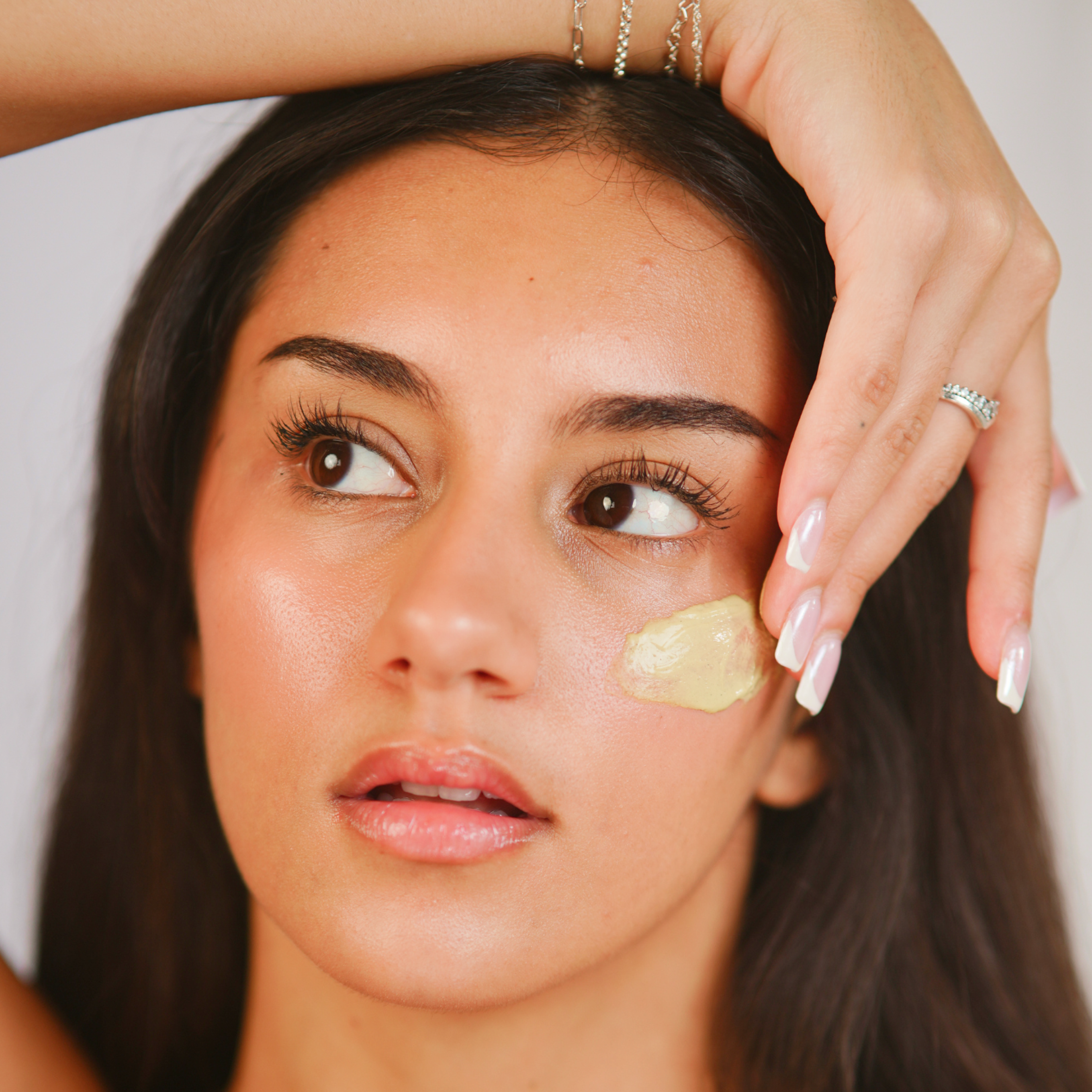 A single green leaf against a white background.